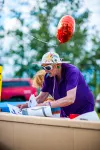 A Member of Trinity Lutheran Church helps to build a cardboard shelter at CARdboard City on Friday night. KATIE STARK/Frontiersman