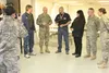 Spec. Joy Petway captures a group photo of NAPA Auto Parts store owner Jim Ruda, Brigadier General Leon “Mike” Bridges, Commanding General of the Alaska Army National Guard and assistant Adju