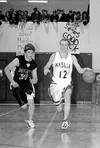 Buddy Bailey brings the ball down the court of the Warriors
during their final regular season contest against Palmer. WILLIAM
WOODY/ Frontiersman