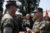 Brenden Kuhlmann, left, is meritoriously promoted to Staff Sgt. by Col. Peter Eltringham on Camp Hansen, Okinawa, Japan, April 11, 2024. Kuhlmann was meritoriously promoted to staff sergeant 