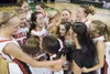 The Wasilla Warriors celebrate after defeating the West Valley Wolfpack 56-33 to claim the 4A state basketball championship Saturday at the Sullivan Arena in Anchorage. Robert DeBerry