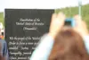 (ROBERT DeBERRY/Frontiersman) Sunrise Rotary member Trish Keown
takes a digital photograph of the new Constitutional Monument at
Iditapark in Wasilla during a Fourth of July dedication
ceremo