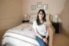 Alyson Tuomi sits inside one of the rooms she has staged in a house that is currently on the market. Tuomi owns Set the Scene Home Staging. Robert DeBerry