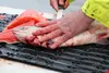 Dave Osantowski fillets the only sockeye salmon a group of four charter boat Copper River dipnetters caught on July 9, 2018. Mary Catharine Martin | SalmonState