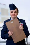 Alaska Air National Guard Tech. Sgt. Cynthia Campbell, 176th Medical Group Clinical Services, judges the performance of Junior ROTC cadets during the Feb. 17, 2024, Alaska statewide JROTC dri