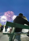 ROBERT DeBERRY/Frontiersman Nick Larrison and Courtney Gabel
watch the fireworks display Friday at the Alaska State Fair in
Palmer. The fair ends Monday.
