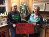 Joe and Aileen Rayfield pose for a photo in their Willow home with a money tree gifted to them by the community for Joe's 100th birthday, Feb. 8. The back of Joe's sweatshirt reads, 'I'm 18 w