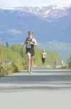 ROBERT DeBERRY/Frontiersman Overall winner in the Curtis C.
Menard II Memorial Run Brenton Knight makes his way down the final
strtch of Saturday’s 5-K course in Wasilla. Knight finished in
1