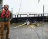 GCI staff engineer Bruce Rein aboard the marine survey vessel Norseman II. Courtesy of GCI