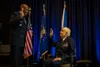 Air Force Chief of Staff Gen. CQ. Brown, Jr. administers the reaffirmation of the oath of office to retired Brig. Gen. Clarence E. “Bud” Anderson, during a ceremony promoting Anderson to the 