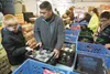 Volunteers from Boy Scout Troop 368 and Cub Scout Troop 300 organize donated food during the Scouting for Food drive Saturday at the Mat-Su Food Bank. The Scouting for Food effort brings in t