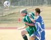 JEREMIAH BARTZ/Frontiersman Colony sophomore Collin Murphy,
left, uses a header to move the ball away from Palmer freshman Zach
Zegydryn during the second half of the Knights’ 1-0 loss to the