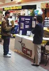A representative from GCI talks to a potential employee at the
Mat-Su Job Fair. More than 55 retailers and government agencies
were at the fair, talking to people and accepting applications.
