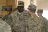 Gen. Lloyd J. Austin III, the commander of U.S. Central Command, speaks to a soldier with 1st Combat Aviation Brigade, 1st Infantry Division, after addressing troops on Nov. 29 at Kandahar Ai