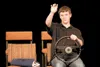 Brendon Stubbs, playing Don Browning, adjusts his rear-view mirror as he works through a scene of the Wasilla High School production of 'Leaving Iowa' in the WHS theater recently. The play op