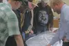 Scott Adams with the engineering firm Dowl/HKM (right) talks to borough residents Wednesday about plans for upgrading Knik-Goose Bay Road from Vine Road to Settler’s Bay Drive. The state is p