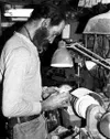 Buz Blum had many interests in art, including poetry,
woodturning, ivory carving and music. Here he turns a bowl at his
home near Sutton. Blum died earlier this month at the age of 63.
Photo 