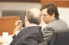 (ROBERT DeBERRY/Frontiersman) Brett A.J. Talmadge, right, talks
with his lawyer last week during his trial in Palmer.