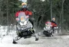 ROBERT DeBERRY/Frontiersman Iron Dog veteran Mike Morgan leads
partner Joe Fuller through a set of whoops during Sunday’s start of
the 2010 Iron Dog snowmachine race.