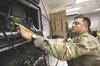 U.S. Army Staff Sgt. Daniel Pau operates a high frequency radio while participating in exercise Arctic Connect. U.S. Army National Guard photo by Alejandro Peña