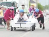The Primrose Retirement Community bed race team charges to the finish line against the Matanuska Telephone Association team during the 2013 Colony Days Executive Bed races in downtown Palmer.