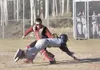 ROBERT DeBERRY/Frontiersman Houston catcher Pat Fitzgerald tags
a Soldotna runner as he dives for home plate during Friday’s game
at Houston High School.