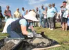 Florene Carney demonstrates how to make a concrete leaf during the Palmer Midsummer Garden and Arts Faire Saturday. ROBERT DeBERRY/Frontiersman.com
