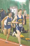 MATT TUNSETH/Frontiersman Kodiak’s Trevor Dunbar leads Palmer’s
Jake Parisien in the 3,200-meter run Saturday at the Big C Relays
at The Dome in Anchorage. Dunbar won the race in a time of 9
