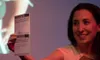 Musician Emily Kurn tries to make a song on the fly from a suggestion written on a card by an audience member at a recent Parlor in the Round performance in Anchorage. Parlor in the Round mak