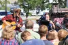 Michael Heath with Sons of Winter Productions operates the camera while Scott Foster plays guitar during filming of the town barbecue scene in ‘Moose the Movie’ July 22, 2014. HEATHER A. RESZ