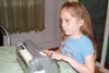Using a Braille machine, Taylor Thompson of Palmer types her
name. Taylor’s mastery of reading Braille allowed her to compete
against her peers this past summer in California. She said she
en