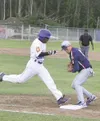 JEREMIAH BARTZ/Frontiersman Alaska Road Warriors first baseman
Dusty Wisdom beats Las Vegas’ Derron Davis to the bag during a loss
to the Lions Saturday.