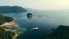 An Uncruise Adventures cruise ship, with a fleet of kayaks in the water behind it, in the Tongass National Forest. Uncruise, a boutique local cruise ship operator, has been vocal about the im