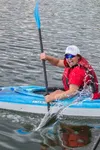 A kayaker races on Wasilla Lake. Courtesy photo by Lisa Phillips.