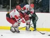 Wasilla's Andrew Cooley and Blake Carricaburu get caught up with Colony's Cole Bloemer during the Warriors' 4-1 win over Colony Friday at the Brett Memorial Ice Arena in Wasilla. ROBERT DeBER