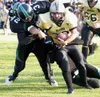 Colony linebacker Kyle Coffman brings down South Anchorage
running back Joe Dougherty during the first half of the Knights'
35-0 victory over the Wolverines on Friday. Photo by JEREMIAH
BARTZ