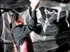Gurpreet Singh hangs cobwebs inside the Mat-Su Borough Animal Care and Regulation Shelter in preparations for the Fur and Fright haunted house, which operates 7 to 11 p.m., today and Saturday