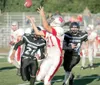 ROBERT DeBERRY/Frontiersman Wasilla Warrior Chris Crane reaches
to make a catch during the Warrior's 21-14 victory over the Chugiak
Mustangs Friday at Chugiak high School.