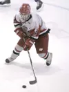 JEREMIAH BARTZ/Frontiersman Wasilla freshman Adam Apangolook
moves the puck down the ice for the Warriors.