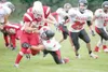 ROBERT DeBERRY/Frontiersman Wasilla sophomore Tyler Polis tries
to break a tackle during a loss to Juneau-Douglas earlier this
season. Last week, Polis scored a pair of touchdowns in a 53-0 w