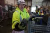 Yago Jacob of Napaskiak, one of the Calista Corp. shareholders employed at the Donlin Gold project, holds up a sliced piece of a geological core on Aug. 11, 2022. Calista is the Native corpor