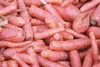 Carrots rest in a plastic storage container outside of storage Friday afternoon at VanderWeele Farms. The VanderWeeles hope to empty their storage barn by April, when rising temperatures and 