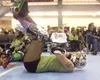 Devil's Club team member The Nubbin warms up with sit ups before
the start of Saturday's rolled derby match against the Sockeye
Sally's at the Curtis D. Menard Memorial Sports Center in Wasil