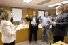 Wasilla City Clerk Kristie Smithers swears in new Wasilla City Council members Steven Lovell, A. Clark Buswell III and Brandon Wall during Monday’s city council meeting. ROBERT DeBERRY/Fronti