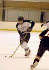 Ryan Pauling moves the puck down the ice against West earlier
this season. Pauling, a Colony forward, led the Valley 4A schools
in goals scored during the first half of the season. Photo by
J
