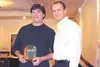 Jim Fairburn of Denali Zipline Tours accepts the Cheechako Award from Mat-Su CVB Membership Manager Justin Saunders during the organization’s annual Stars of the Industry awards luncheon.  Co