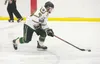 Colony Knight Gunner Stadem moves the puck across the ice during a recent game at the Curtis C. Menard II Memorial Ice Arena in Wasilla. ROBERT DeBERRY/Frontiersman.com