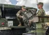 South Carolina National Guard Soldiers from the 108th Public Affairs Detachment in Eastover, S.C., load gear into a Humvee in preparation to support partnered civilian agencies and safeguard 