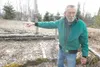 ROBERT DeBERRY/Frontiersman Mack Duregloh, whose home off
Goldendale Drive is surrounded by beds for a winter’s supply of
squash, asparagus and prize-winning flowers, says the crops are
jeopa