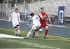 Wasilla captain Kyle Broach is contacted by a Palmer defender during a 4-1 Northern Lights Conference win over the Moose May 11, 2016, at Palmer High School. JEREMIAH BARTZ/Frontiersman